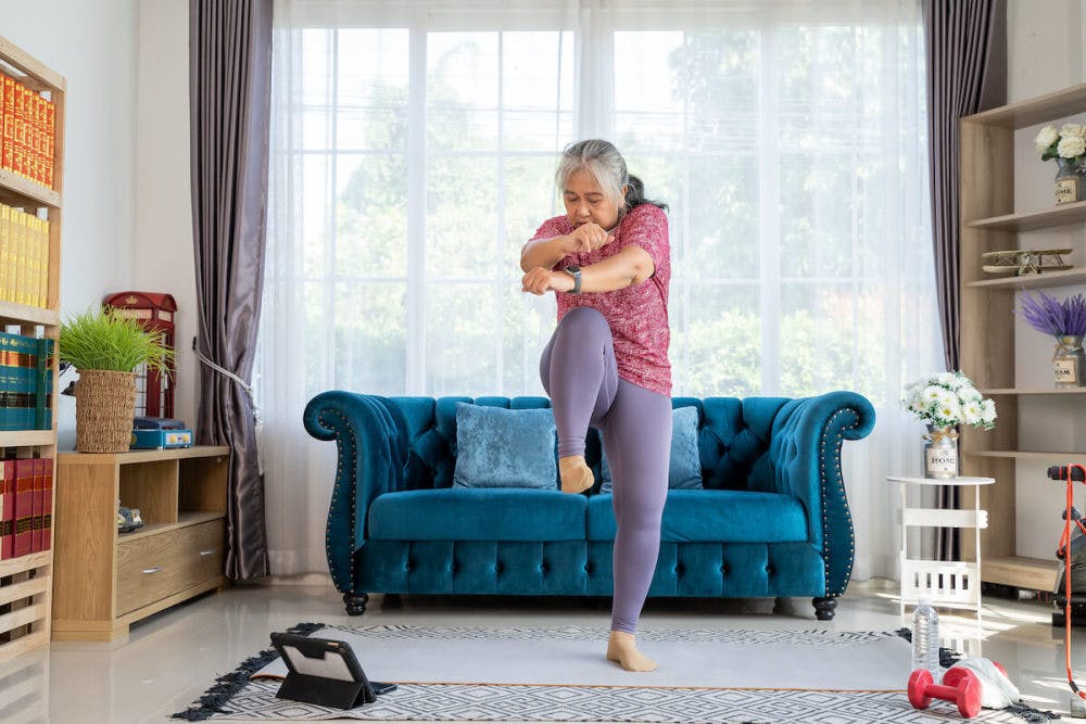 HIIT Workouts for Women: elderly woman doing the high knees
